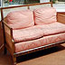 Sunny conservatory with sofa and dining table